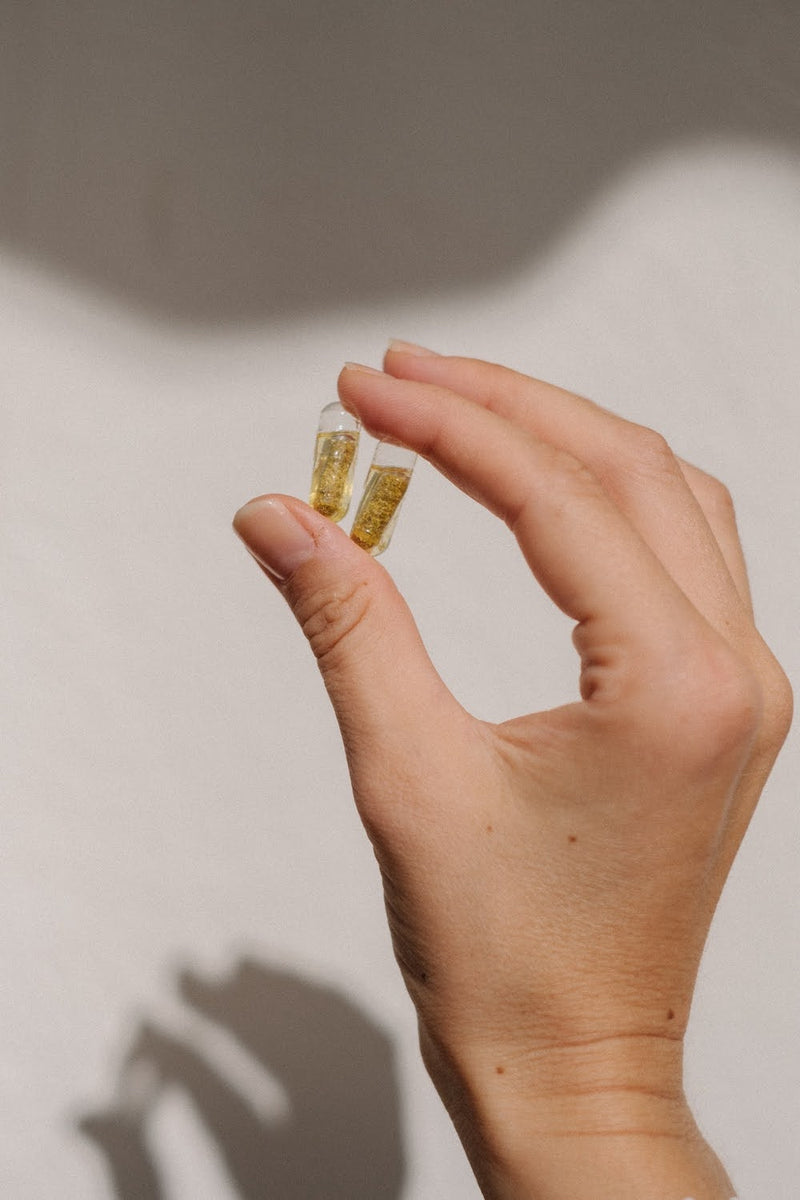 Photo de deux capsules du complément alimentaire Baby bump de Jolly Mama